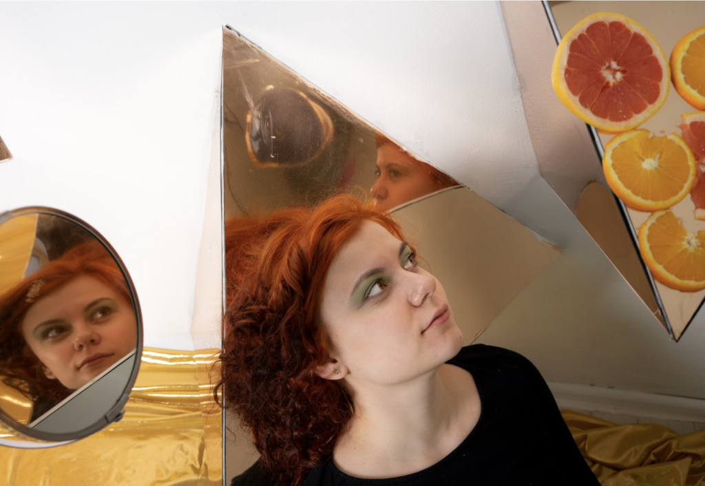 woman surrounded by mirrors